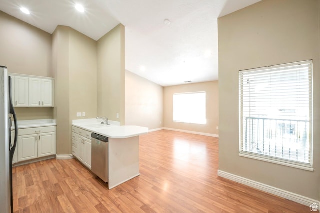 861 W Columbia Ln Unit 21, Provo, UT 84604 - kitchen featuring a peninsula, stainless steel appliances, light wood finished floors, and high vaulted ceiling