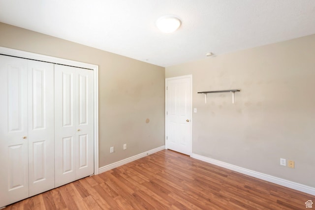 861 W Columbia Ln Unit 21, Provo, UT 84604 - unfurnished bedroom featuring light wood-style floors and a closet