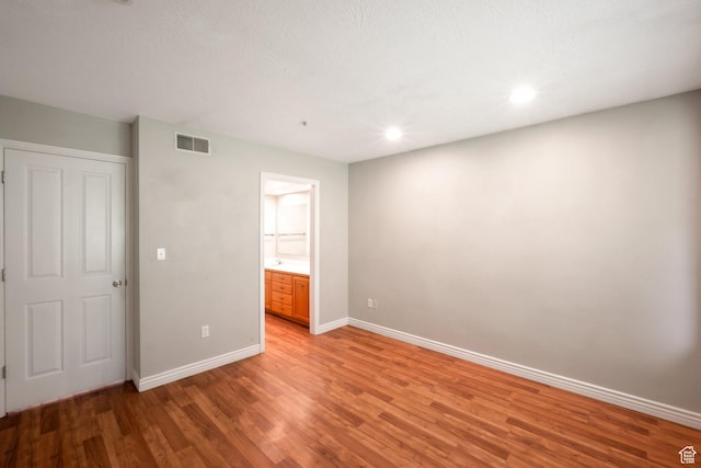 861 W Columbia Ln Unit 21, Provo, UT 84604 - unfurnished bedroom featuring light wood finished floors, recessed lighting, and connected bathroom