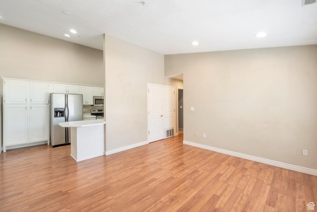 861 W Columbia Ln Unit 21, Provo, UT 84604 - unfurnished living room featuring light wood-style floors, recessed lighting, and high vaulted ceiling