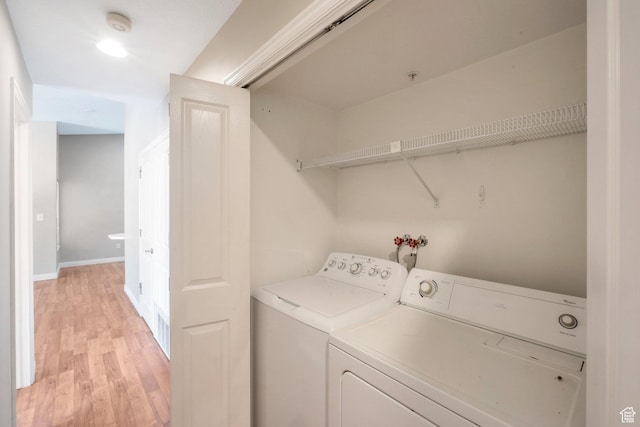 861 W Columbia Ln Unit 21, Provo, UT 84604 - washroom featuring washing machine and dryer and light wood-type flooring
