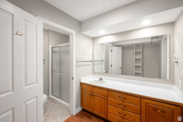 861 W Columbia Ln Unit 21, Provo, UT 84604 - bathroom featuring a stall shower, vanity, and a spacious closet