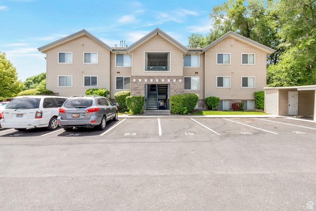861 W Columbia Ln Unit 21, Provo, UT 84604 - view of building exterior with uncovered parking