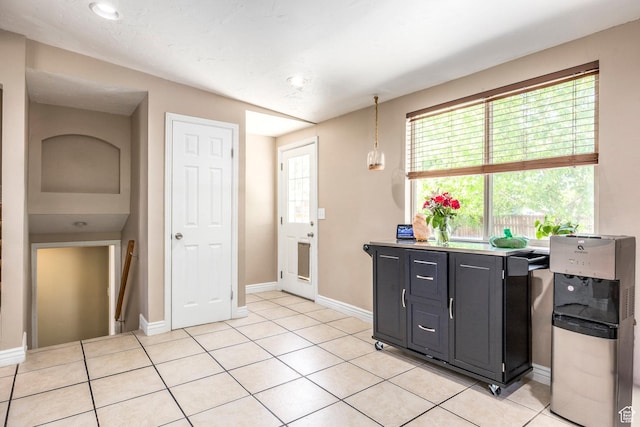 2039 W Camelot S, West Jordan, UT 84084 - kitchen featuring dark cabinetry, light tile patterned flooring, recessed lighting, and hanging light fixtures