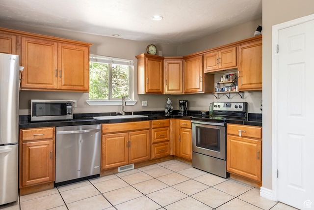2039 W Camelot S, West Jordan, UT 84084 - kitchen with appliances with stainless steel finishes, light tile patterned floors, recessed lighting, brown cabinetry, and open shelves