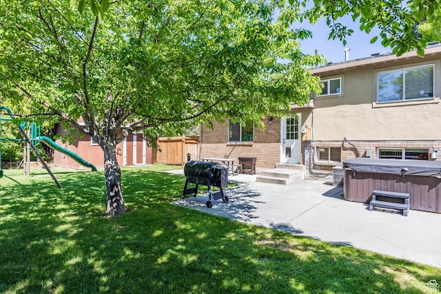 2039 W Camelot S, West Jordan, UT 84084 - fenced backyard with a hot tub, a patio, a playground, and a shed
