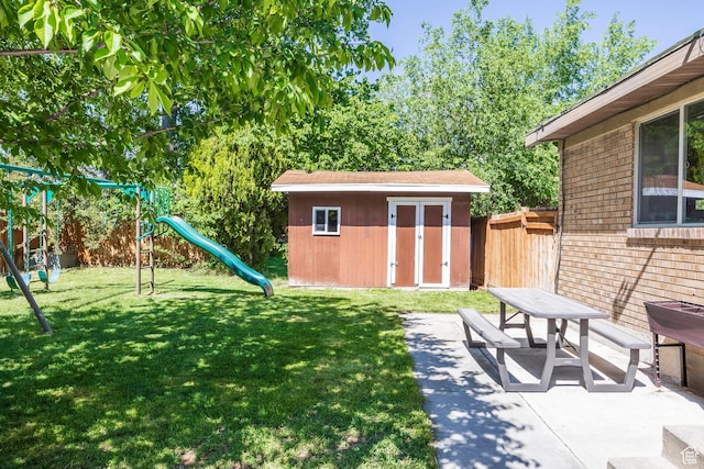 2039 W Camelot S, West Jordan, UT 84084 - view of yard with a playground, a storage unit, and a patio area