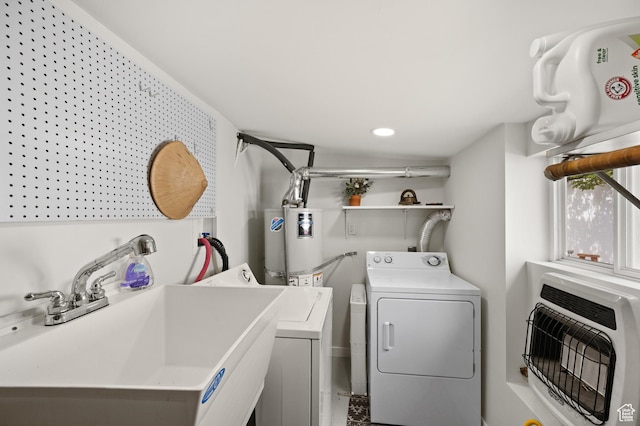 3175 S Imperial St, Millcreek, UT 84106 - laundry area with heating unit, separate washer and dryer, and gas water heater
