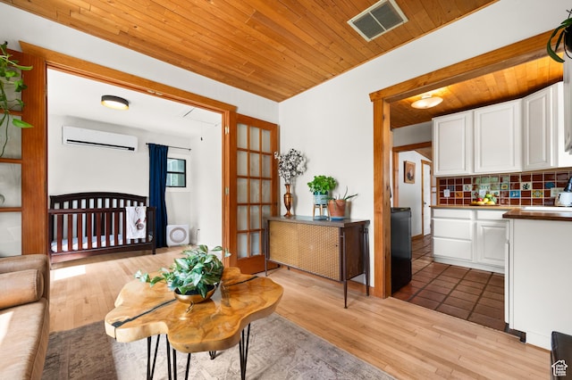 3175 S Imperial St, Millcreek, UT 84106 - living room with an AC wall unit, wood ceiling, and light wood-style flooring