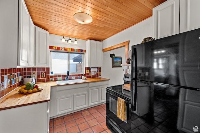 3175 S Imperial St, Millcreek, UT 84106 - kitchen with black appliances, butcher block countertops, wooden ceiling, backsplash, and white cabinets