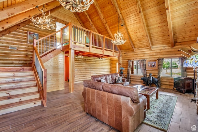 366 E Valley Dr S, Park City, UT 84098 - living area featuring a chandelier, a wood stove, a wood ceiling with exposed beams, stairway, and high vaulted ceiling