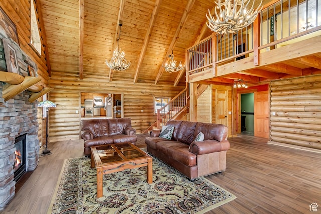 366 E Valley Dr S, Park City, UT 84098 - living area featuring a chandelier, high vaulted ceiling, a wood ceiling with exposed beams, stairs, and rustic walls