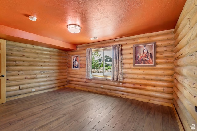 366 E Valley Dr S, Park City, UT 84098 - spare room with a textured ceiling, wood finished floors, a smoke detector, and rustic walls