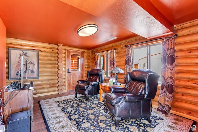 366 E Valley Dr S, Park City, UT 84098 - sitting room featuring wood finished floors, log walls, and stairs