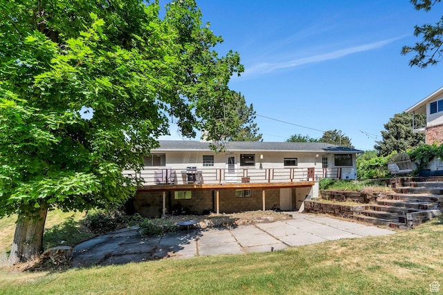 2040 N Oakcrest Ter, Provo, UT 84604 - back of house with a wooden deck, a patio area, and a lawn