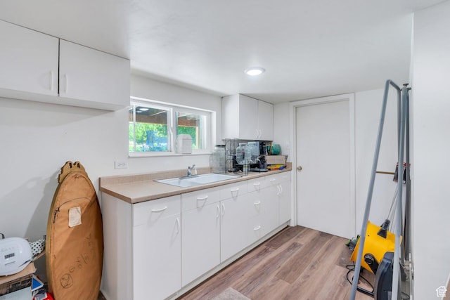 2040 N Oakcrest Ter, Provo, UT 84604 - kitchen with light wood finished floors, light countertops, and white cabinetry