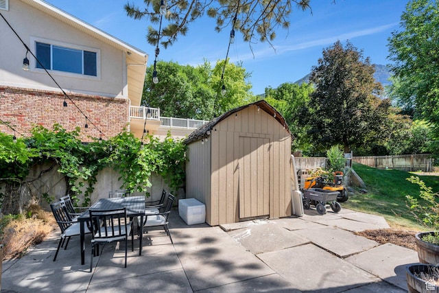 2040 N Oakcrest Ter, Provo, UT 84604 - view of patio / terrace featuring a storage shed and outdoor dining space