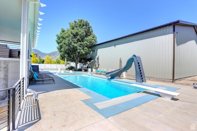 1767 S 800 W, Mapleton, UT 84664 - view of pool featuring a water slide, a diving board, a patio area, and a mountain view