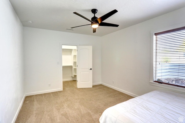 1767 S 800 W, Mapleton, UT 84664 - bedroom featuring light carpet, a walk in closet, ceiling fan, and a closet