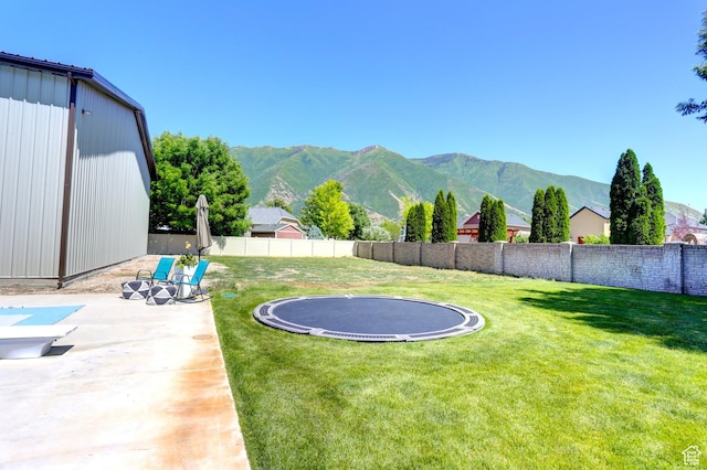 1767 S 800 W, Mapleton, UT 84664 - fenced backyard featuring a trampoline, a mountain view, and a patio