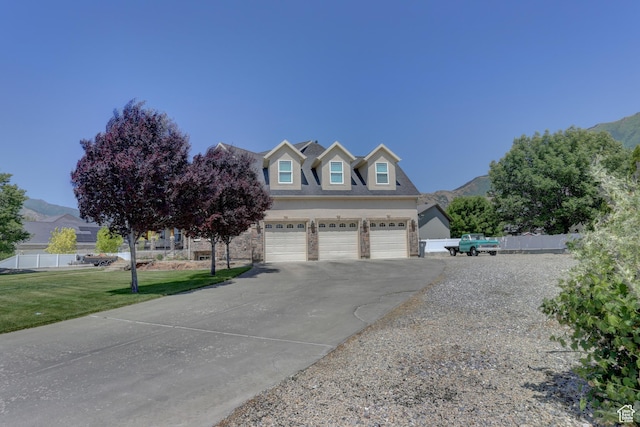 1767 S 800 W, Mapleton, UT 84664 - view of front of home with driveway, a garage, and a mountain view