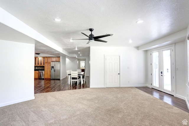 1767 S 800 W, Mapleton, UT 84664 - living room featuring dark colored carpet, a textured ceiling, plenty of natural light, dark wood-style floors, and recessed lighting