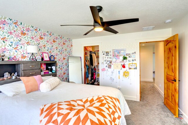1767 S 800 W, Mapleton, UT 84664 - bedroom with wallpapered walls, a walk in closet, carpet, a closet, and a textured ceiling