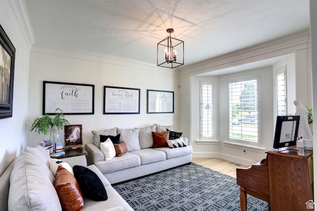 1767 S 800 W, Mapleton, UT 84664 - living area with a chandelier, wood finished floors, crown molding, and a textured ceiling