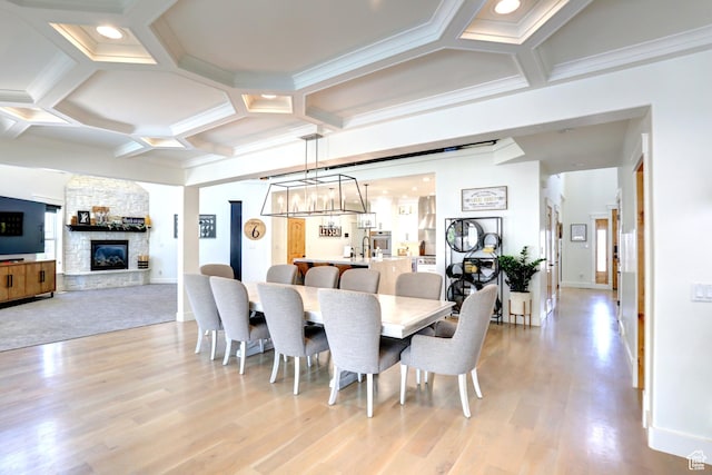 1767 S 800 W, Mapleton, UT 84664 - dining space with coffered ceiling, a stone fireplace, light wood-type flooring, a chandelier, and beamed ceiling