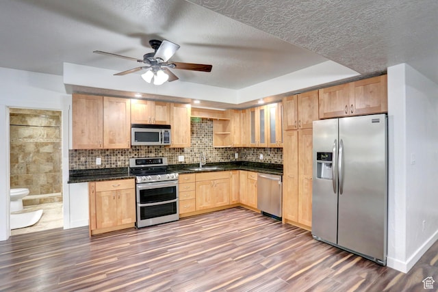 1767 S 800 W, Mapleton, UT 84664 - kitchen featuring stainless steel appliances, light brown cabinetry, dark countertops, a ceiling fan, and a textured ceiling