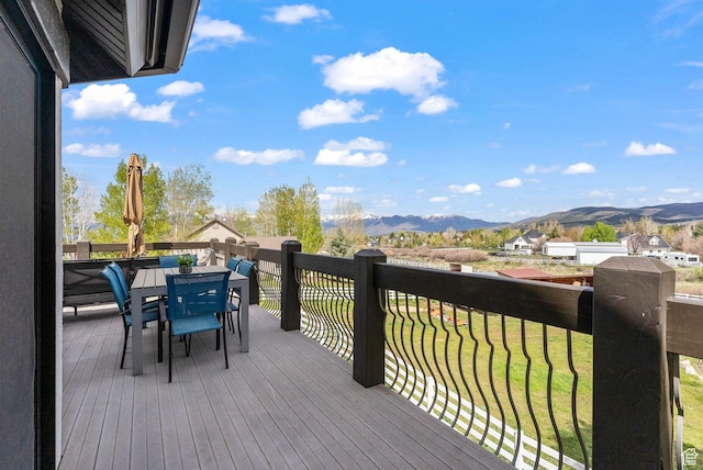 4555 Palomino Dr, Heber City, UT 84032 - wooden terrace featuring a mountain view, outdoor dining area, and a lawn