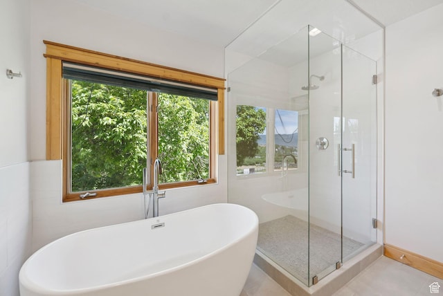 4555 Palomino Dr, Heber City, UT 84032 - bathroom with a soaking tub, a stall shower, and tile patterned flooring
