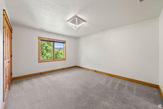 4555 Palomino Dr, Heber City, UT 84032 - spare room featuring carpet flooring and a textured ceiling