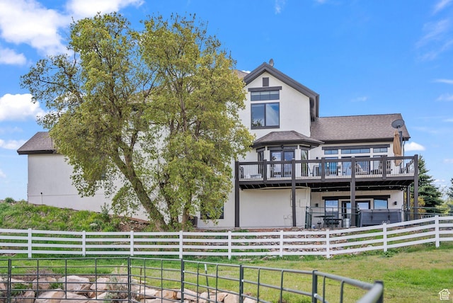 4555 Palomino Dr, Heber City, UT 84032 - back of property featuring a deck, stucco siding, and roof with shingles
