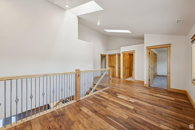 4555 Palomino Dr, Heber City, UT 84032 - hallway with a skylight, lofted ceiling, and wood finished floors