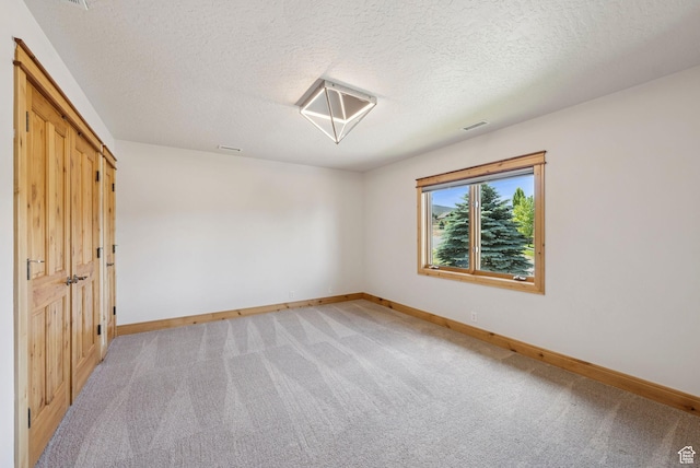 4555 Palomino Dr, Heber City, UT 84032 - unfurnished bedroom with light carpet and a textured ceiling