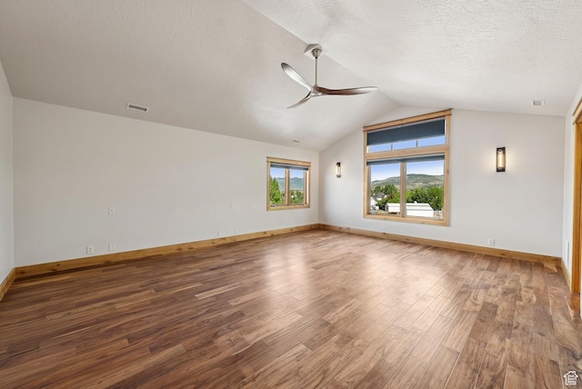 4555 Palomino Dr, Heber City, UT 84032 - empty room featuring ceiling fan, wood finished floors, lofted ceiling, and a textured ceiling