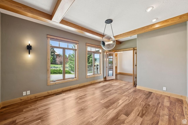 4555 Palomino Dr, Heber City, UT 84032 - unfurnished dining area featuring wood finished floors and beamed ceiling
