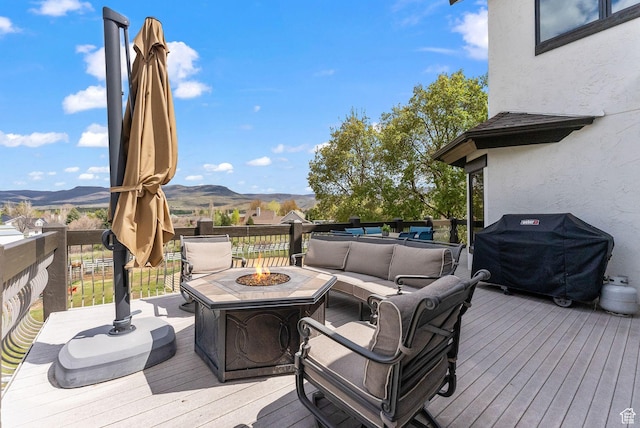 4555 Palomino Dr, Heber City, UT 84032 - wooden terrace with area for grilling, an outdoor living space with a fire pit, and a mountain view
