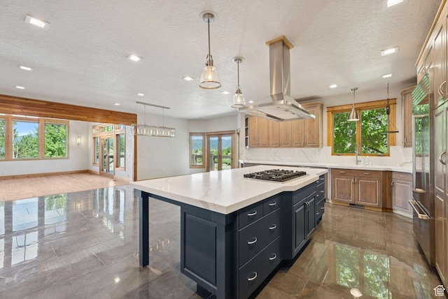 4555 Palomino Dr, Heber City, UT 84032 - kitchen with island range hood, stainless steel gas stovetop, a textured ceiling, light countertops, and a kitchen island