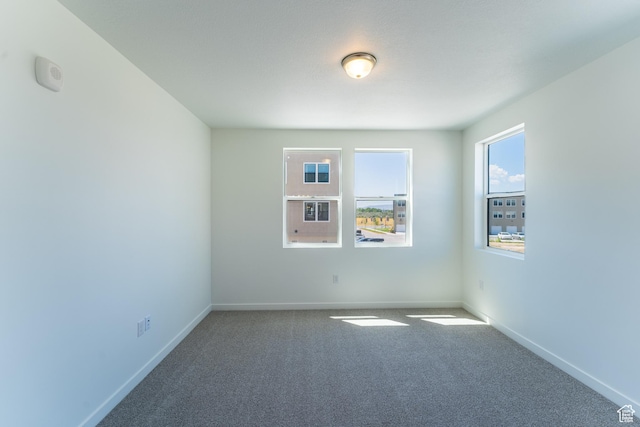8333 S Iris Lumi Ln W Unit Q304, Midvale, UT 84047 - empty room with carpet floors and baseboards