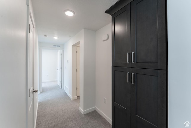 8333 S Iris Lumi Ln W Unit Q304, Midvale, UT 84047 - hallway featuring light colored carpet and baseboards