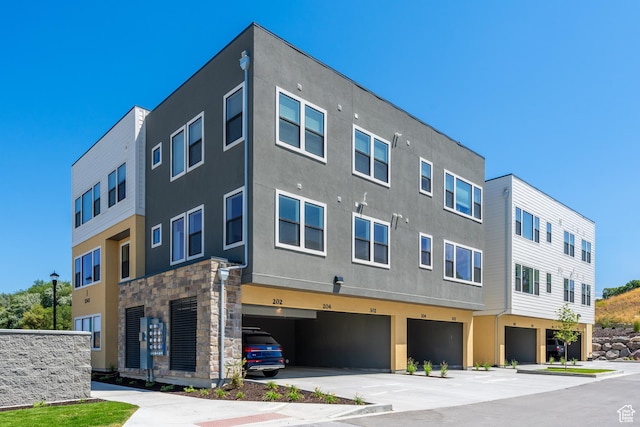 8333 S Iris Lumi Ln W Unit Q304, Midvale, UT 84047 - view of property with an attached garage