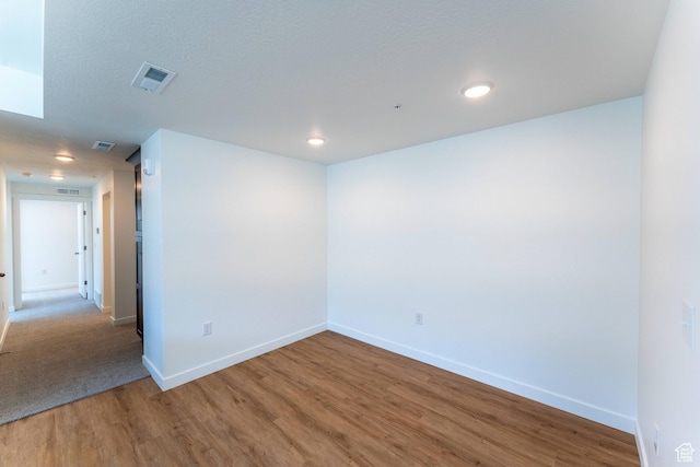 8333 S Iris Lumi Ln W Unit Q304, Midvale, UT 84047 - empty room featuring wood finished floors and recessed lighting