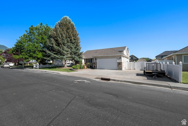 1343 W 870 N, Pleasant Grove, UT 84062 - view of front of property featuring a garage, driveway, and a residential view