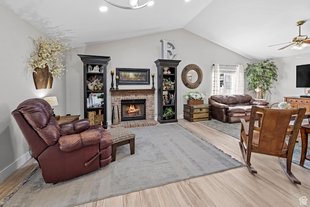 1343 W 870 N, Pleasant Grove, UT 84062 - living area featuring vaulted ceiling, a brick fireplace, wood finished floors, a ceiling fan, and recessed lighting