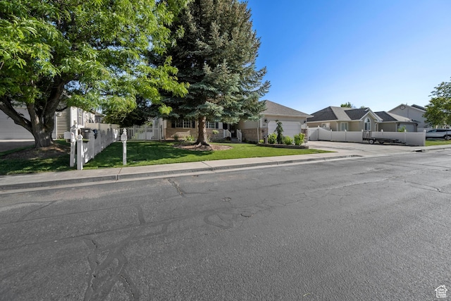 1343 W 870 N, Pleasant Grove, UT 84062 - view of property hidden behind natural elements with concrete driveway, an attached garage, and a residential view