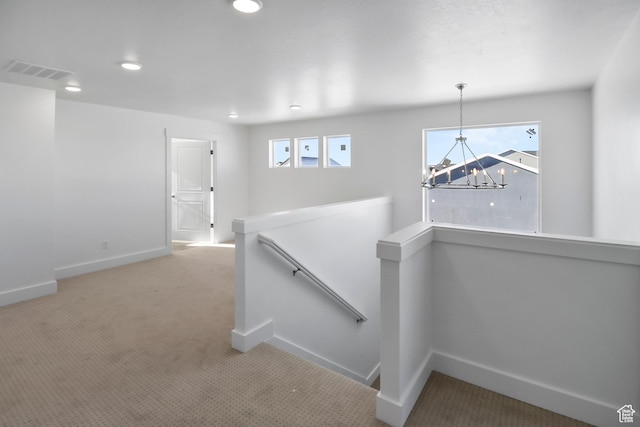 167 N 950 E Unit 30, Tremonton, UT 84337 - hallway with an upstairs landing, a chandelier, carpet flooring, and recessed lighting