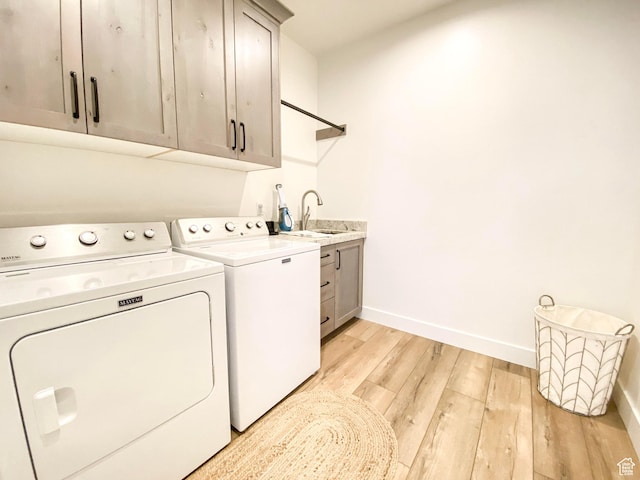 96 W 350 S, Garden City, UT 84028 - laundry room with cabinet space, washer and clothes dryer, and light wood-type flooring
