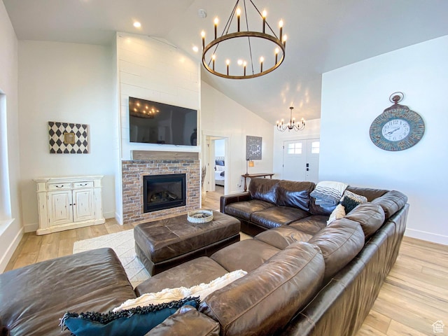 96 W 350 S, Garden City, UT 84028 - living area featuring a chandelier, light wood-style flooring, high vaulted ceiling, a glass covered fireplace, and recessed lighting